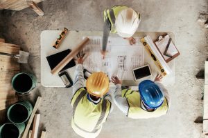 Group of construction professionals viewing project plans
