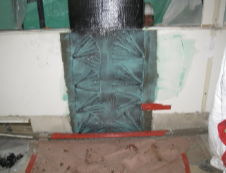 Column wrap with fiber anchors