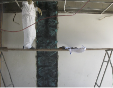 FRP strip with fiber anchors at an interior wall