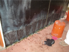 Fiber anchors fanned at the base of a wall