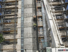 Ironworkers working on the exterior face