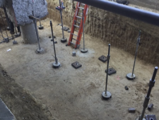Micropiles around an existing pile cap