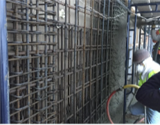 Shotcrete placed against boundary-element cages